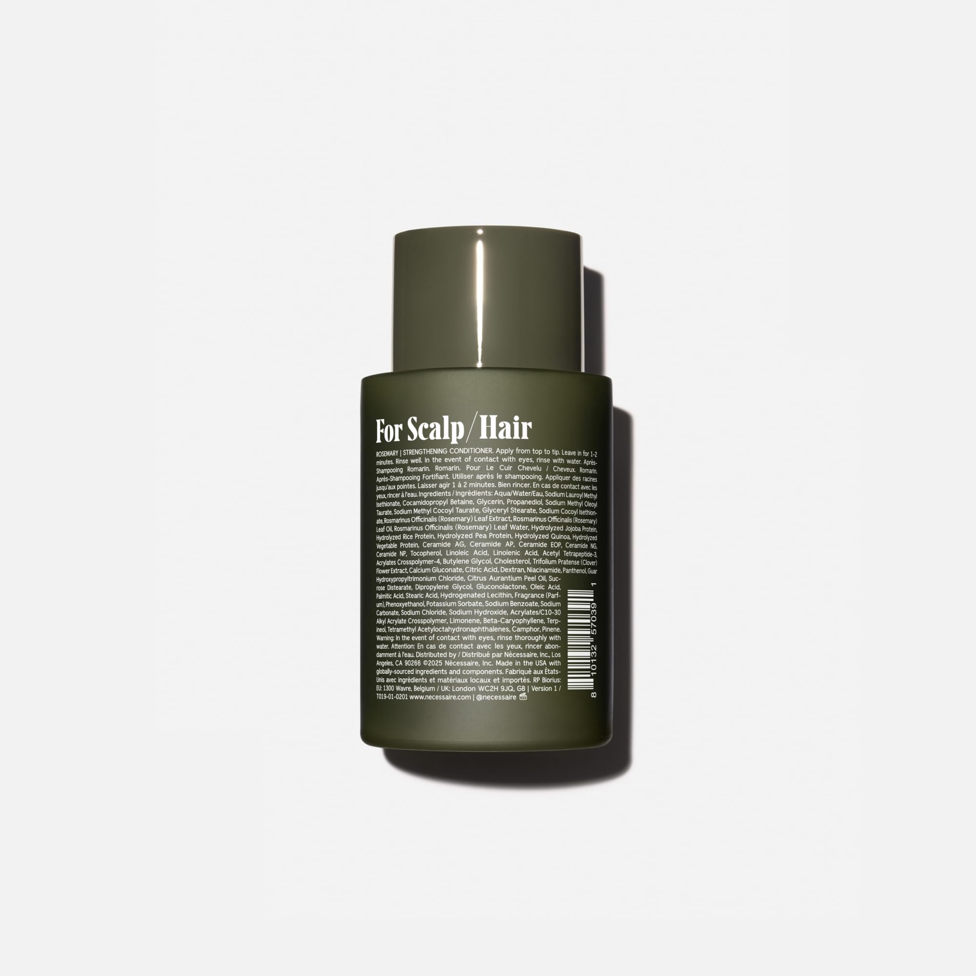 Nécessaire Rosemary Conditioner being applied to hair for smooth combing.