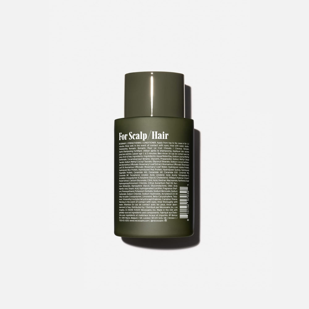 Nécessaire Rosemary Conditioner being applied to hair for smooth combing.