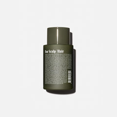 Nécessaire Rosemary Conditioner being applied to hair for smooth combing.