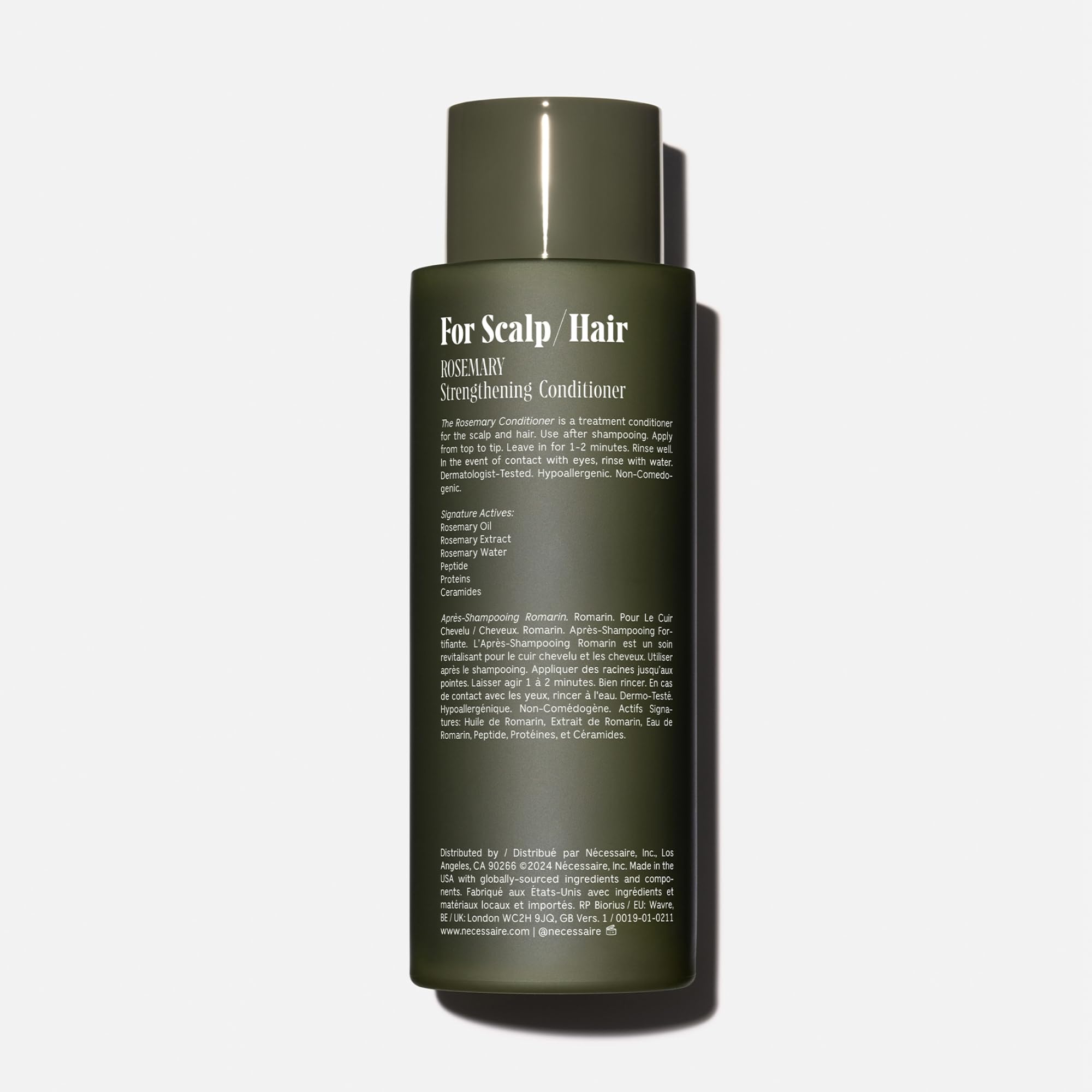 Nécessaire Rosemary Conditioner bottle pour demonstrates even distribution through hair lengths.