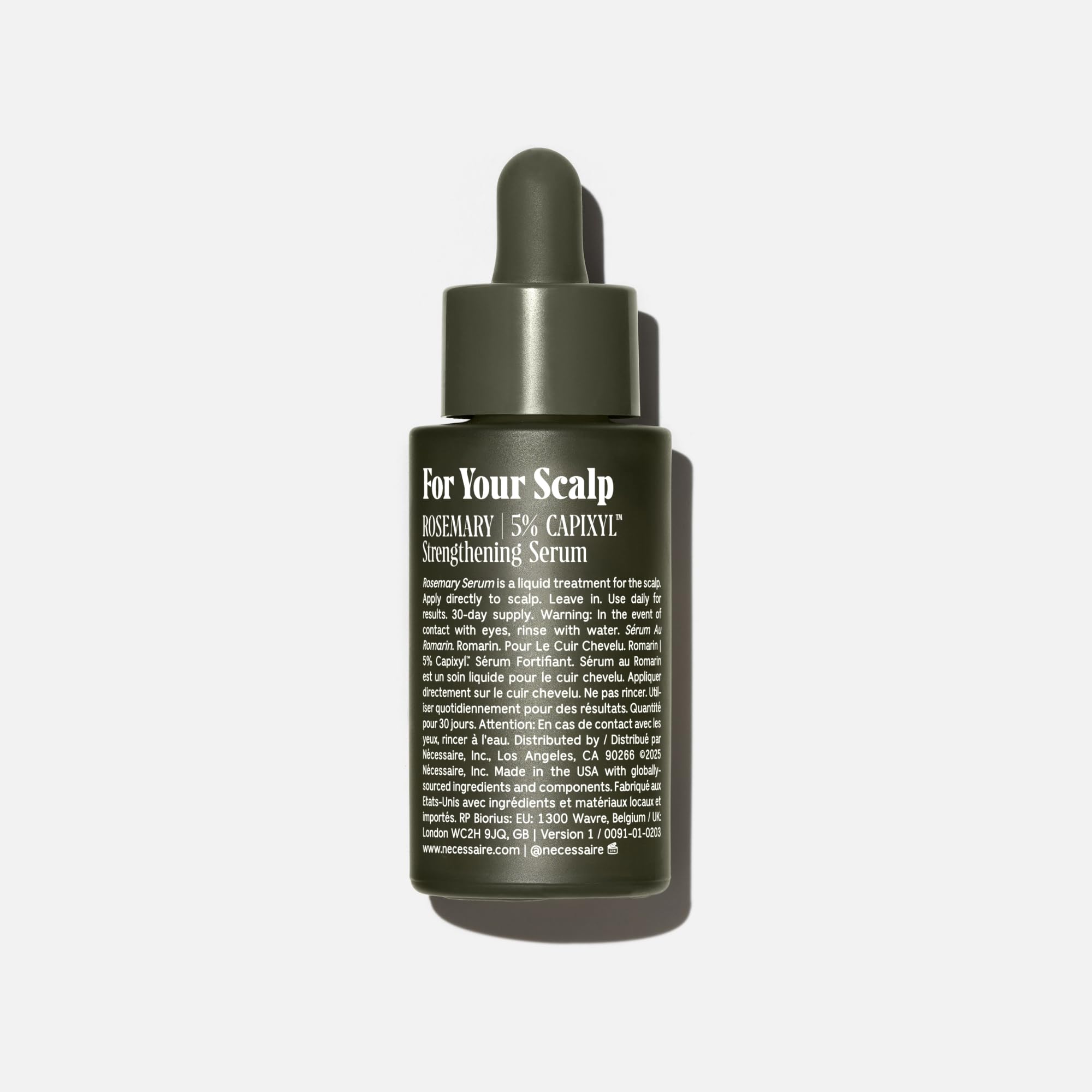 Nécessaire Rosemary Serum dropper applying to scalp for easy use.