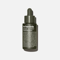 Nécessaire Rosemary Serum dropper applying to scalp for easy use.