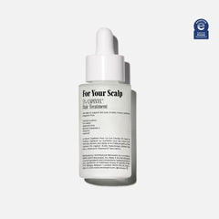 Nécessaire Scalp Serum glass bottle close-up showing minimalist fragrance-free design.