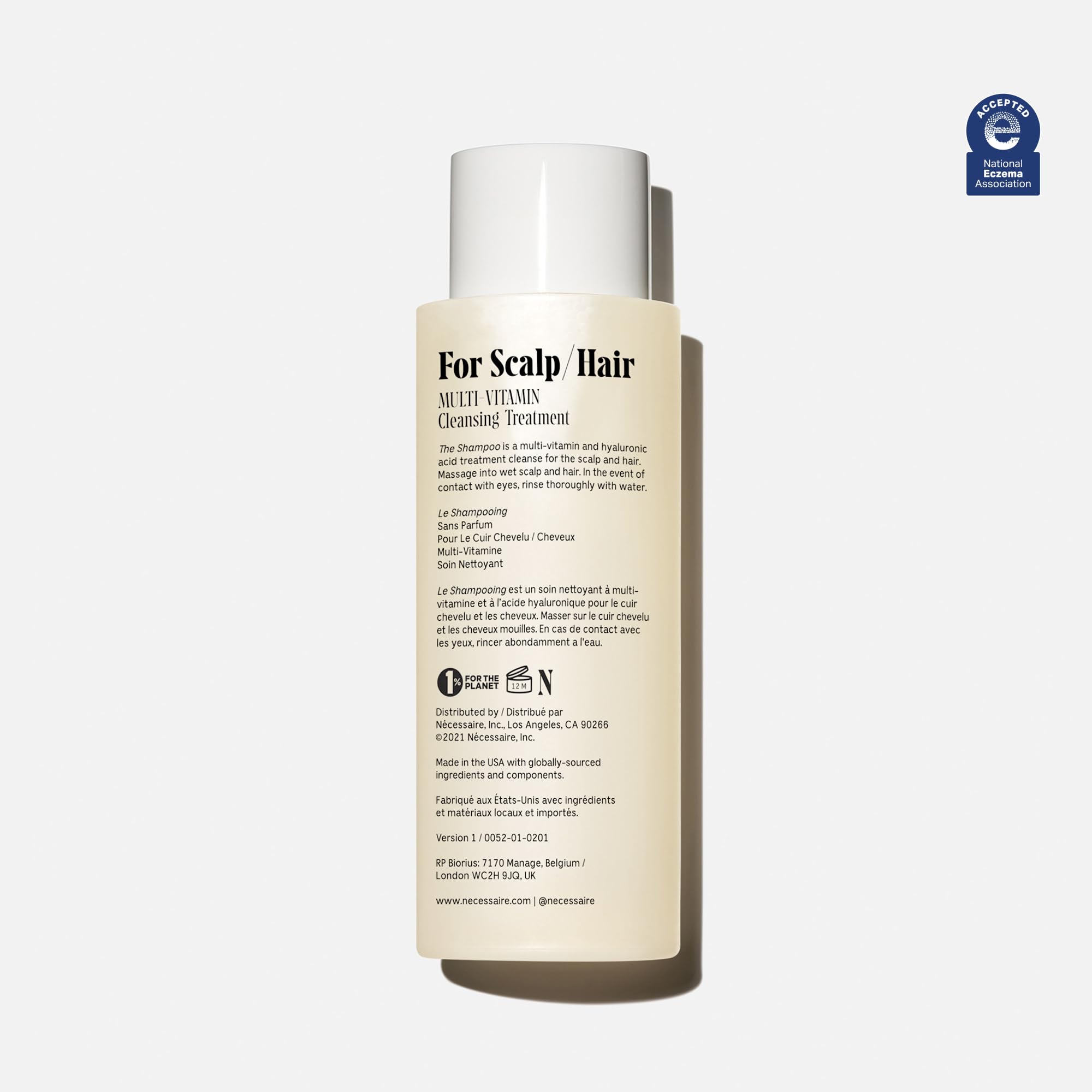 Nécessaire shampoo foam close-up showing gentle lather.