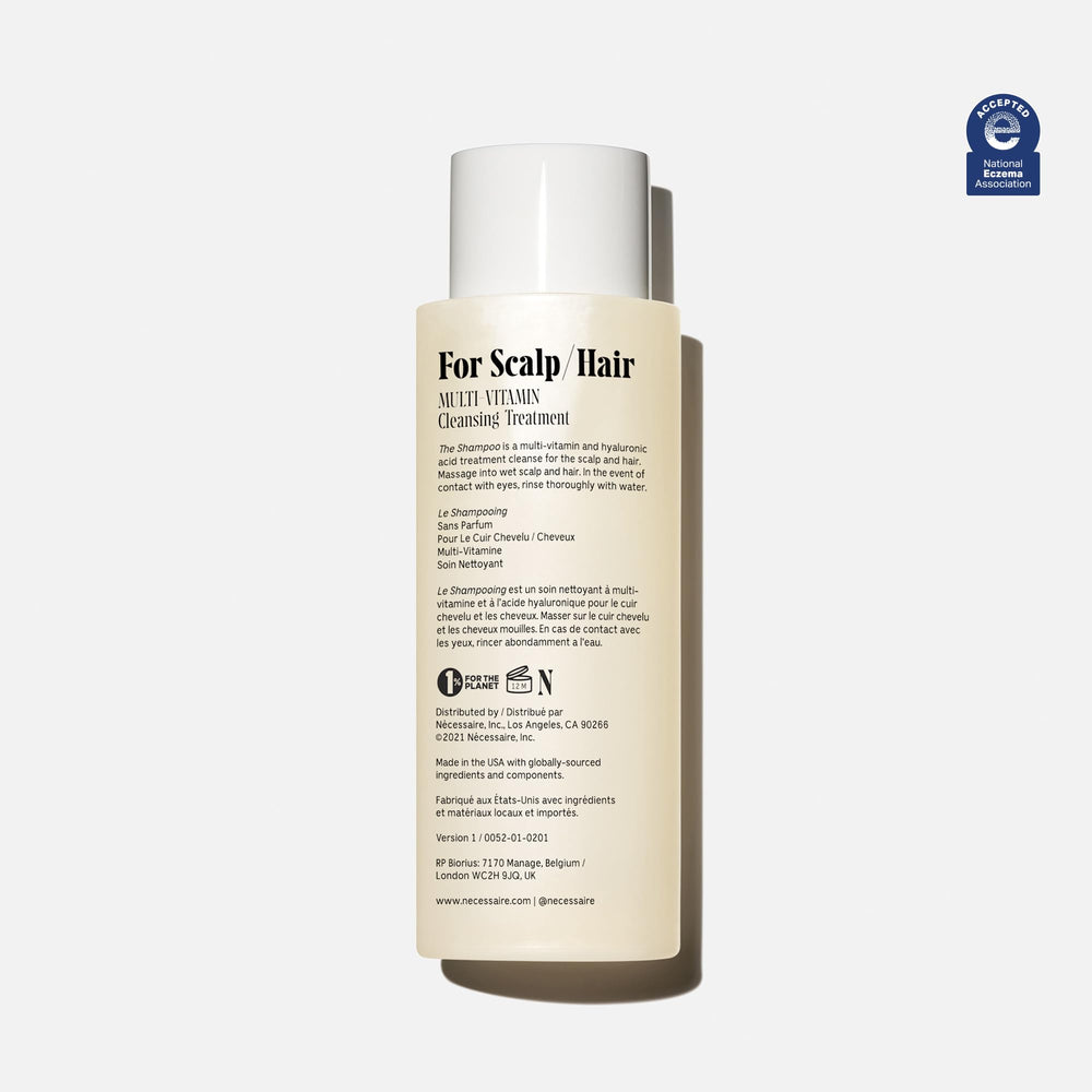 Nécessaire shampoo foam close-up showing gentle lather.