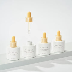 NEEDLY Vita C Glow Toning Ampoule dropper releasing serum