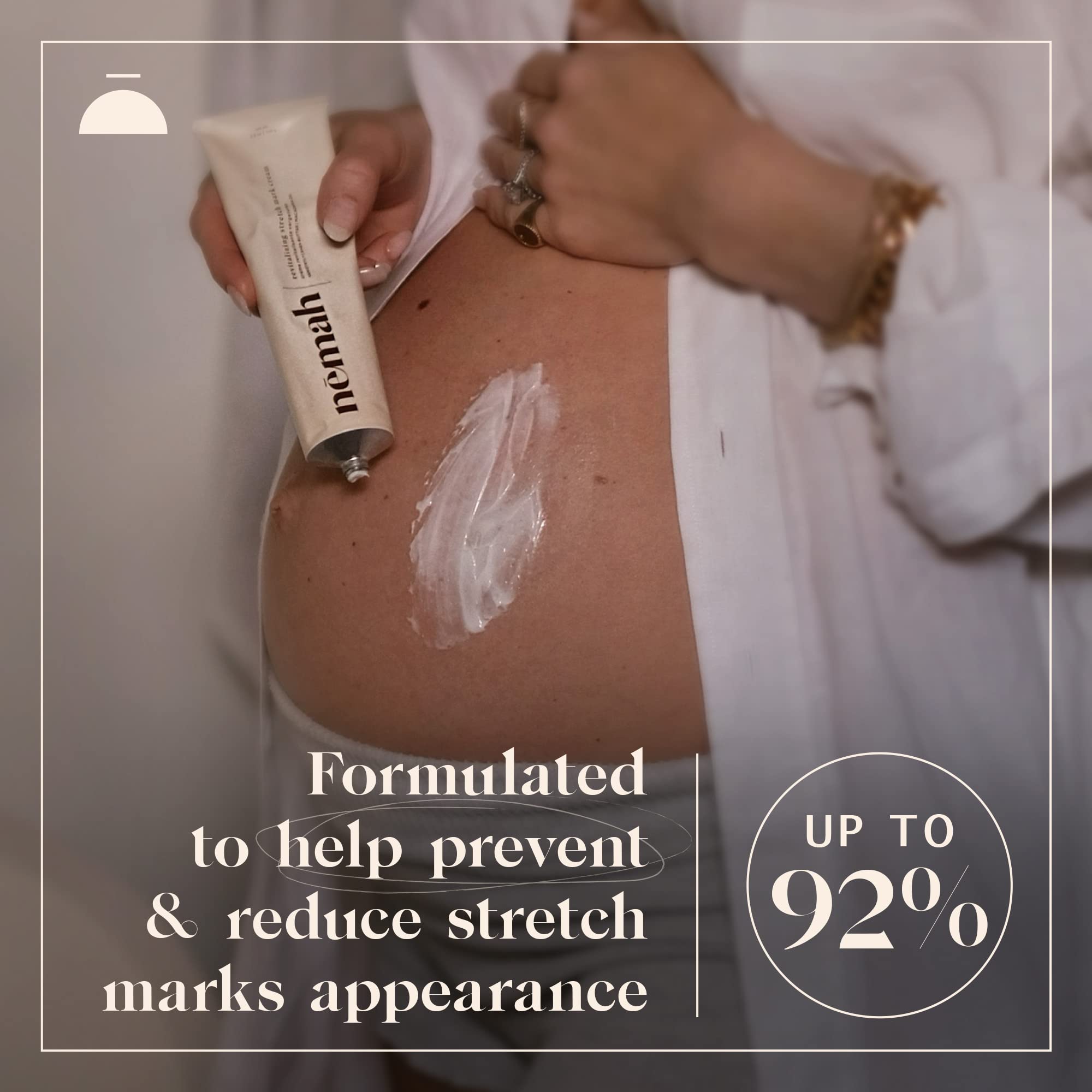 Nemah stretch mark cream jar held in hands shows creamy consistency.