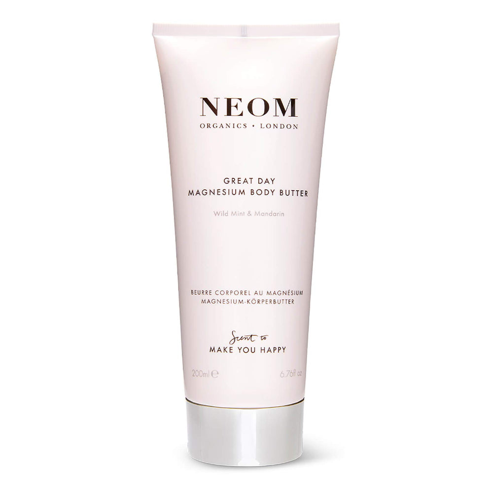 Neom Great Day Magnesium Body Butter bottle glows with uplifting, zesty mandarin and peppermint scent.
