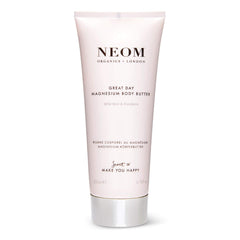 Neom Great Day Magnesium Body Butter bottle glows with uplifting, zesty mandarin and peppermint scent.