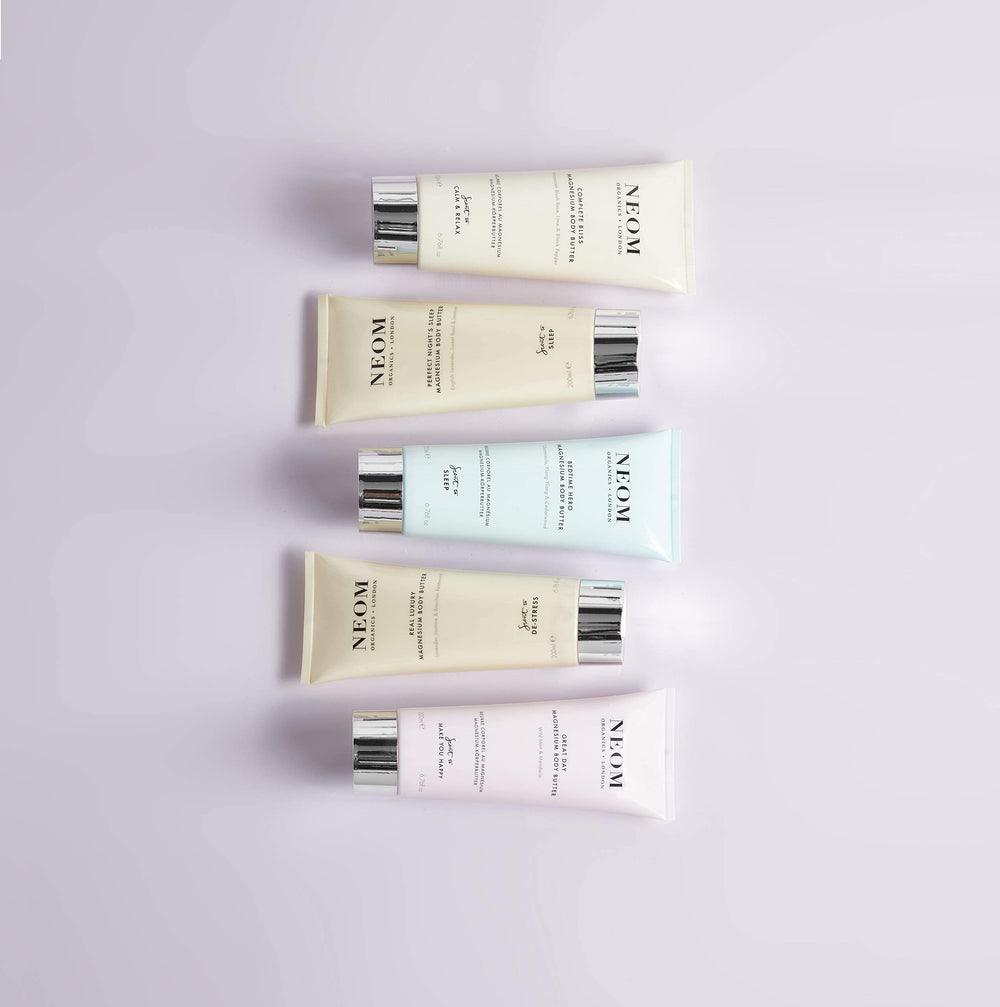 Neom Great Day ingredients list shows shea, aloe, oils.