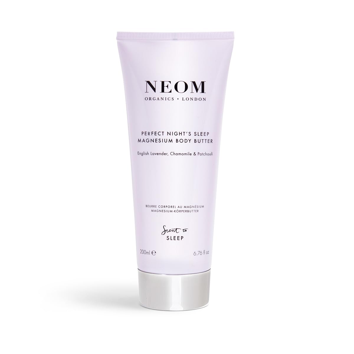 Close-up of Neom lavender, chamomile, and patchouli essential oils for a calming bedtime ritual.