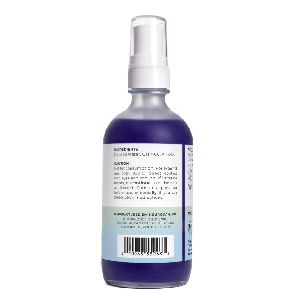 Neurogan daily scalp serum mist being sprayed for targeted application.
