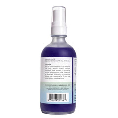 Neurogan daily scalp serum mist being sprayed for targeted application.