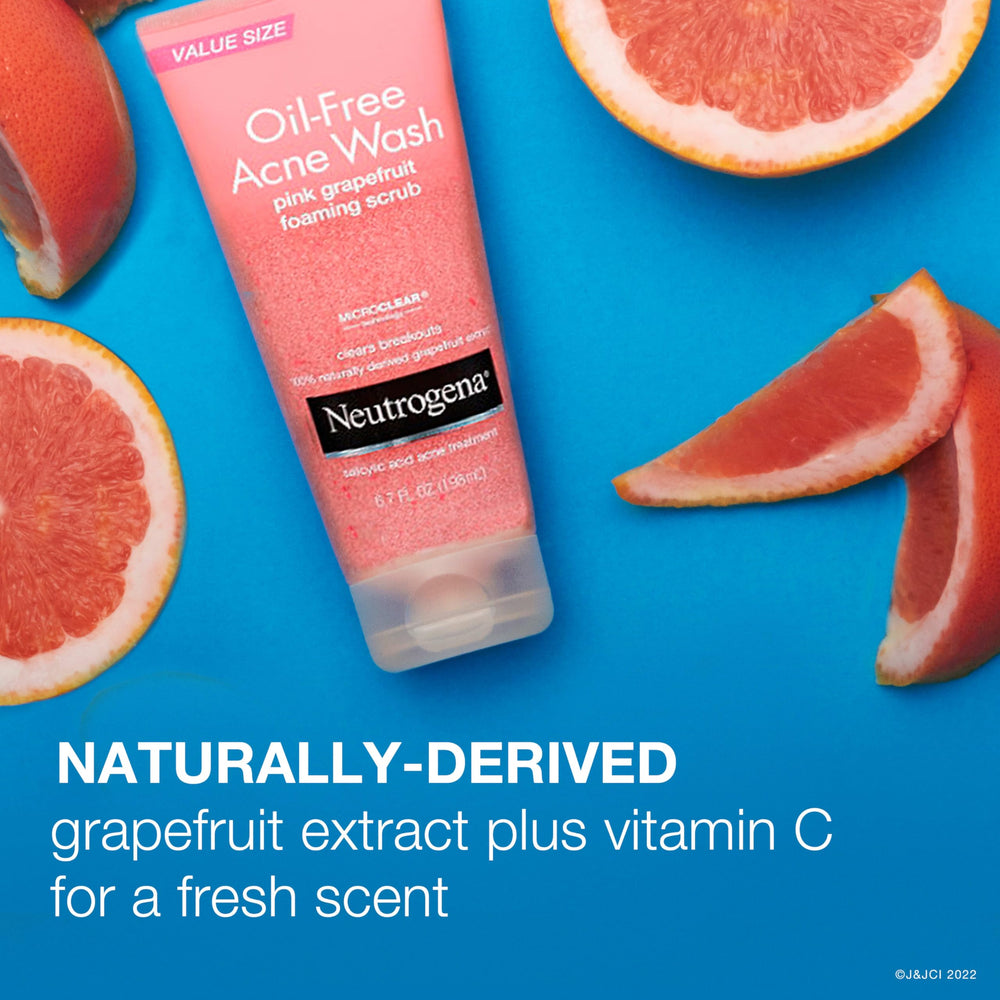 Hand with lather using Neutrogena Pink Grapefruit Foaming Scrub demonstrates foaming action.