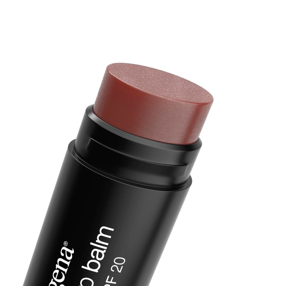 Close-up of Neutrogena Revitalizing Tinted Lip Balm application showing moisture and color