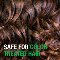 Applying Neutrogena Tea Tree Oil Conditioner to damp hair for moisturized ends