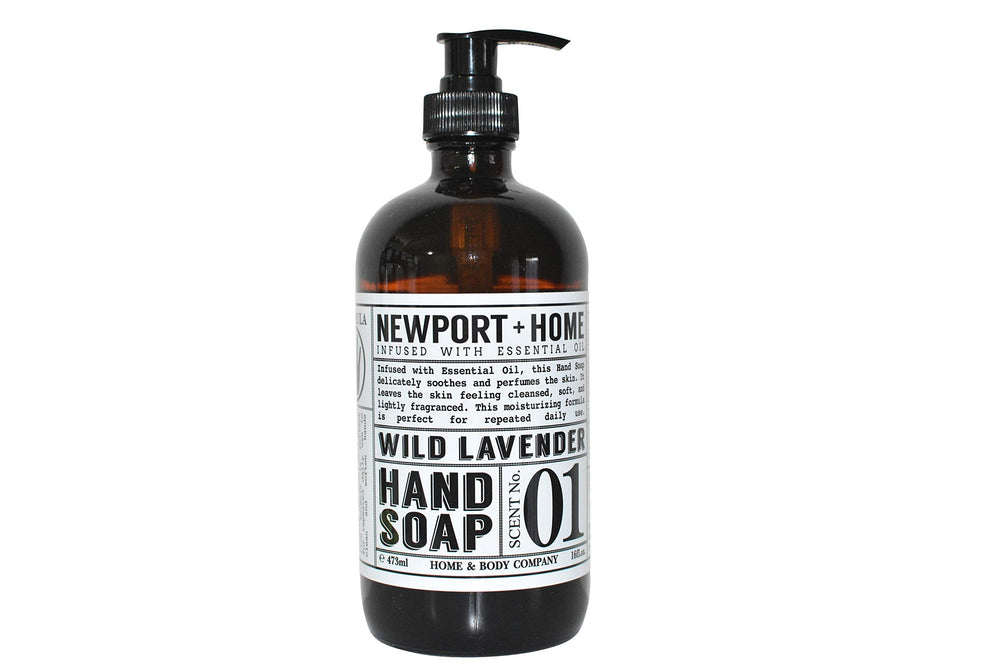 Newport Home Hand Soap Co Wild Lavender 16 oz glass bottle on a sink, stylish and refillable.
