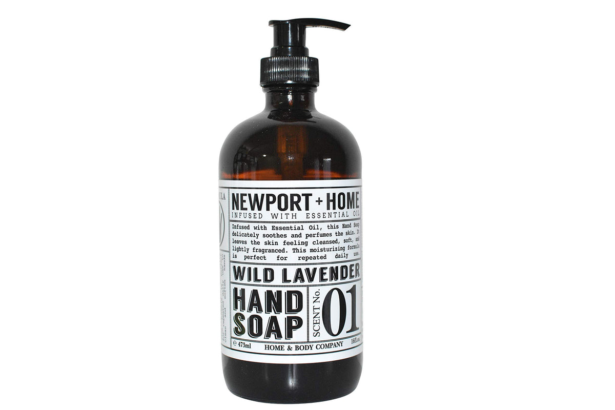 Newport Home Hand Soap Co Wild Lavender 16 oz glass bottle on a sink, stylish and refillable.