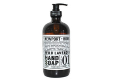 Newport Home Hand Soap Co Wild Lavender 16 oz glass bottle on a sink, stylish and refillable.