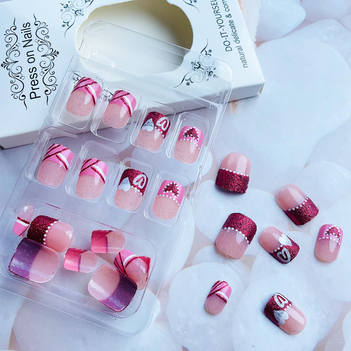 NEWSPIED French tip nails offering a timeless look at home.