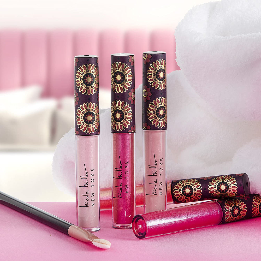 Swatches show varied tones from the Nicole Miller lip gloss collection