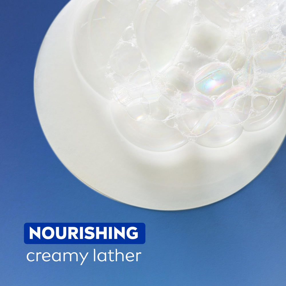 Fragrance notes of tropical coconut and almond milk shown on the NIVEA bottle.
