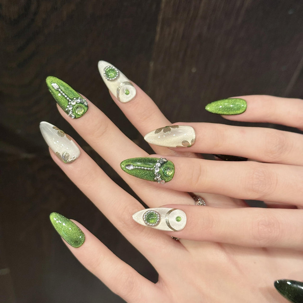 NLSJMP hand-painted nails showcase gentle green artistry for versatile outfits.