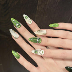 NLSJMP hand-painted nails showcase gentle green artistry for versatile outfits.