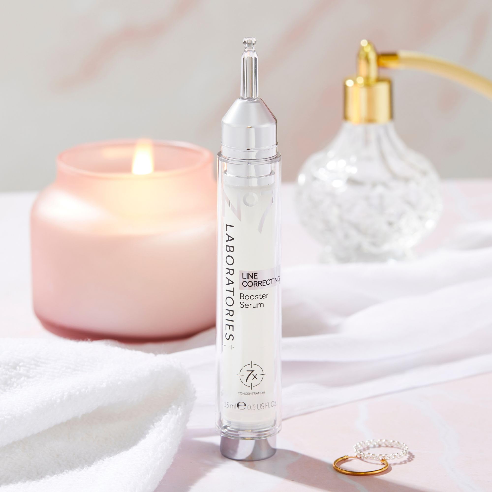No7 booster serum on application finger showing controlled, targeted use.