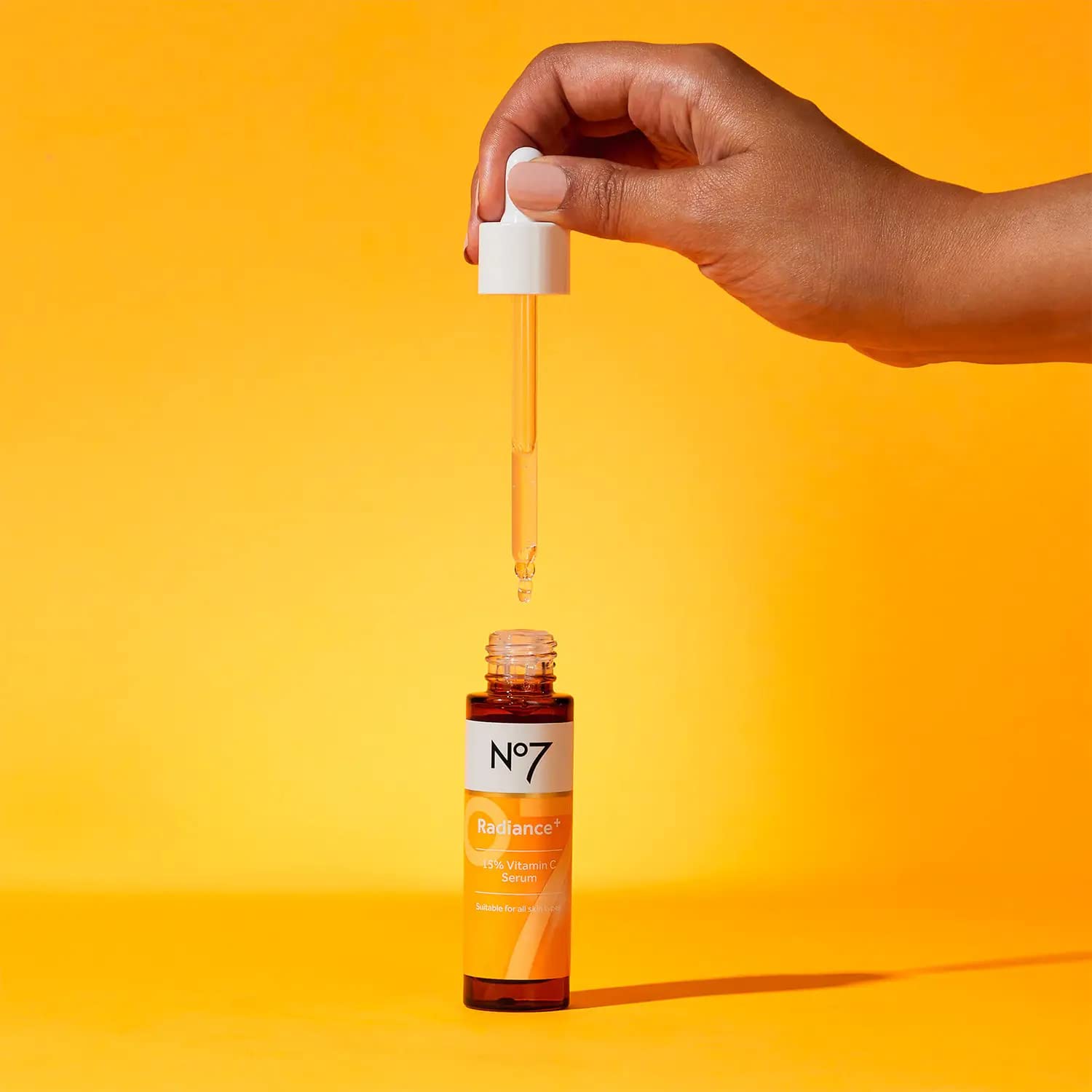 No7 Radiance+ serum on skin for a healthy glow.