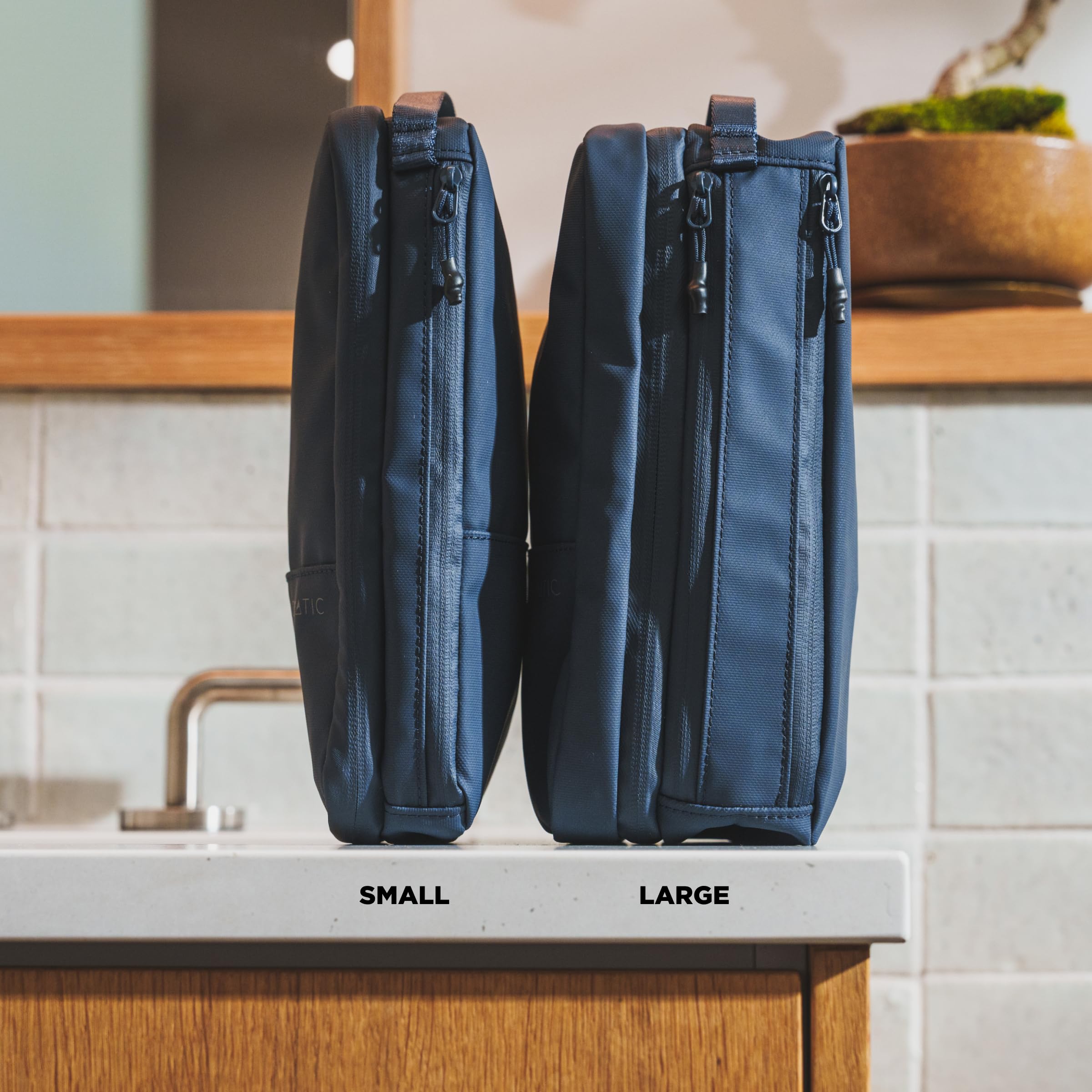 NOMATIC Toiletry Bag multiple storage compartments help separate shaving, cosmetics, and toiletries.