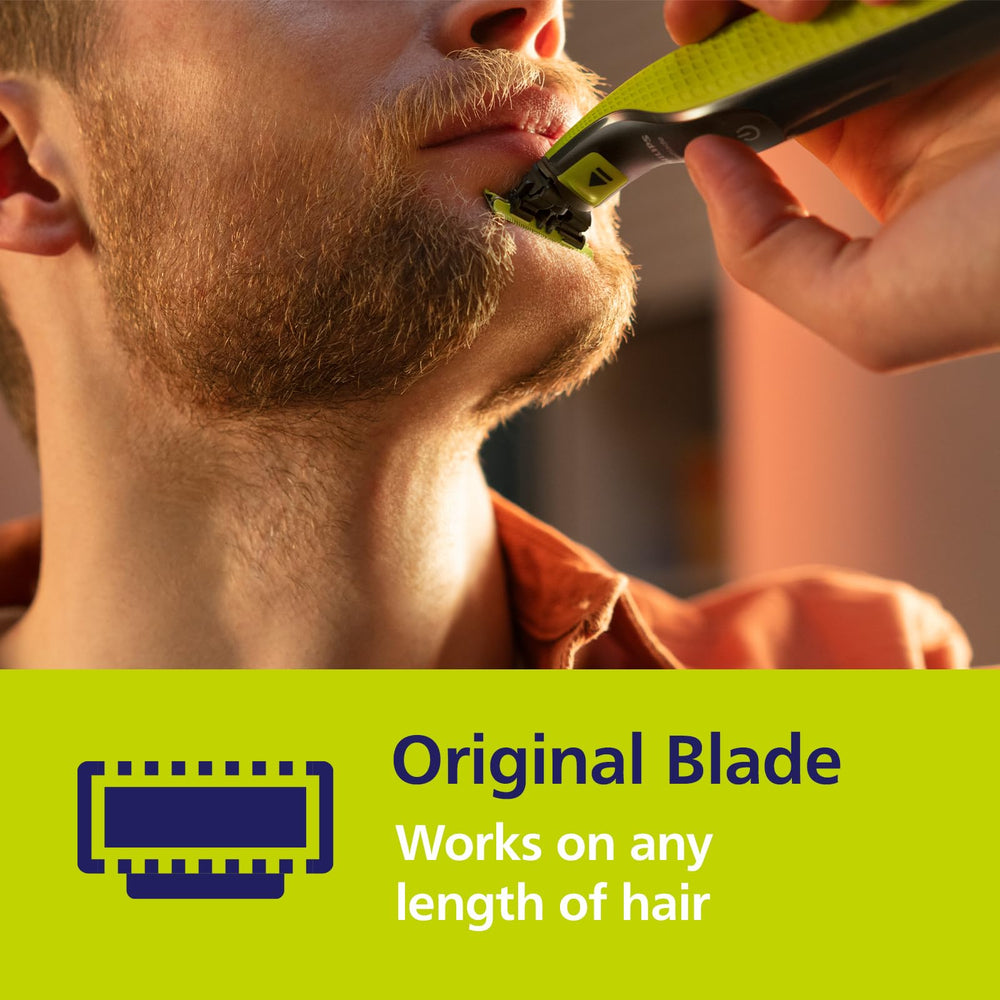 Norelco OneBlade close-up blade showing precise cutting.