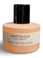 Close-up of Nostalgia Perfumery Walk in the Sand cap on a round bottle