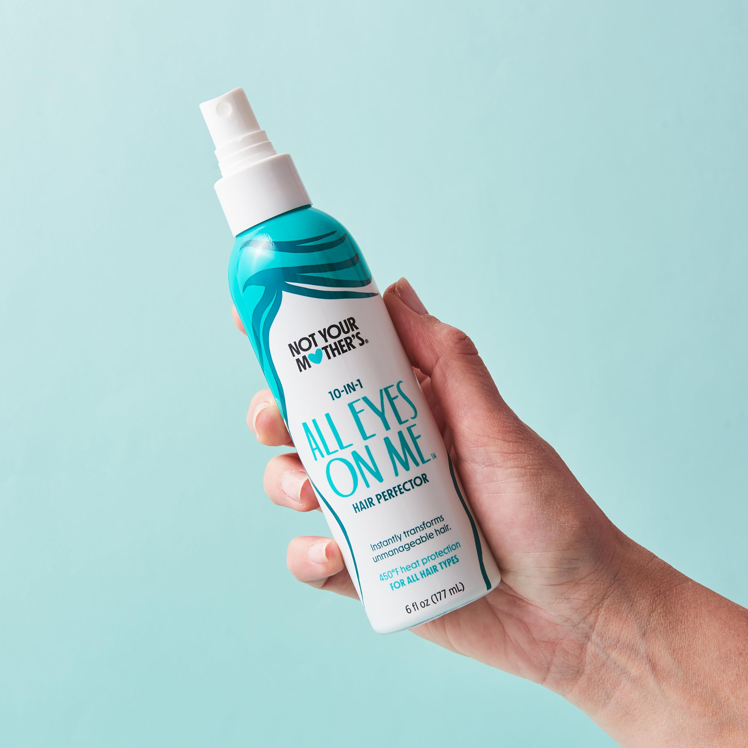 Not Your Mother's All Eyes On Me frizz-control spray on curly or straight hair.