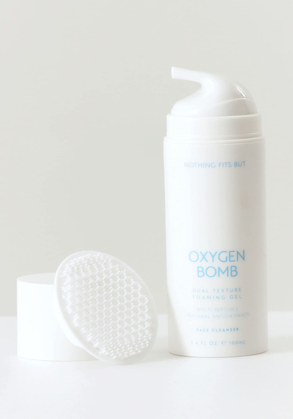 Nothing Fits But Oxygen Bomb dual texture application highlights gentle exfoliation for smoother skin.