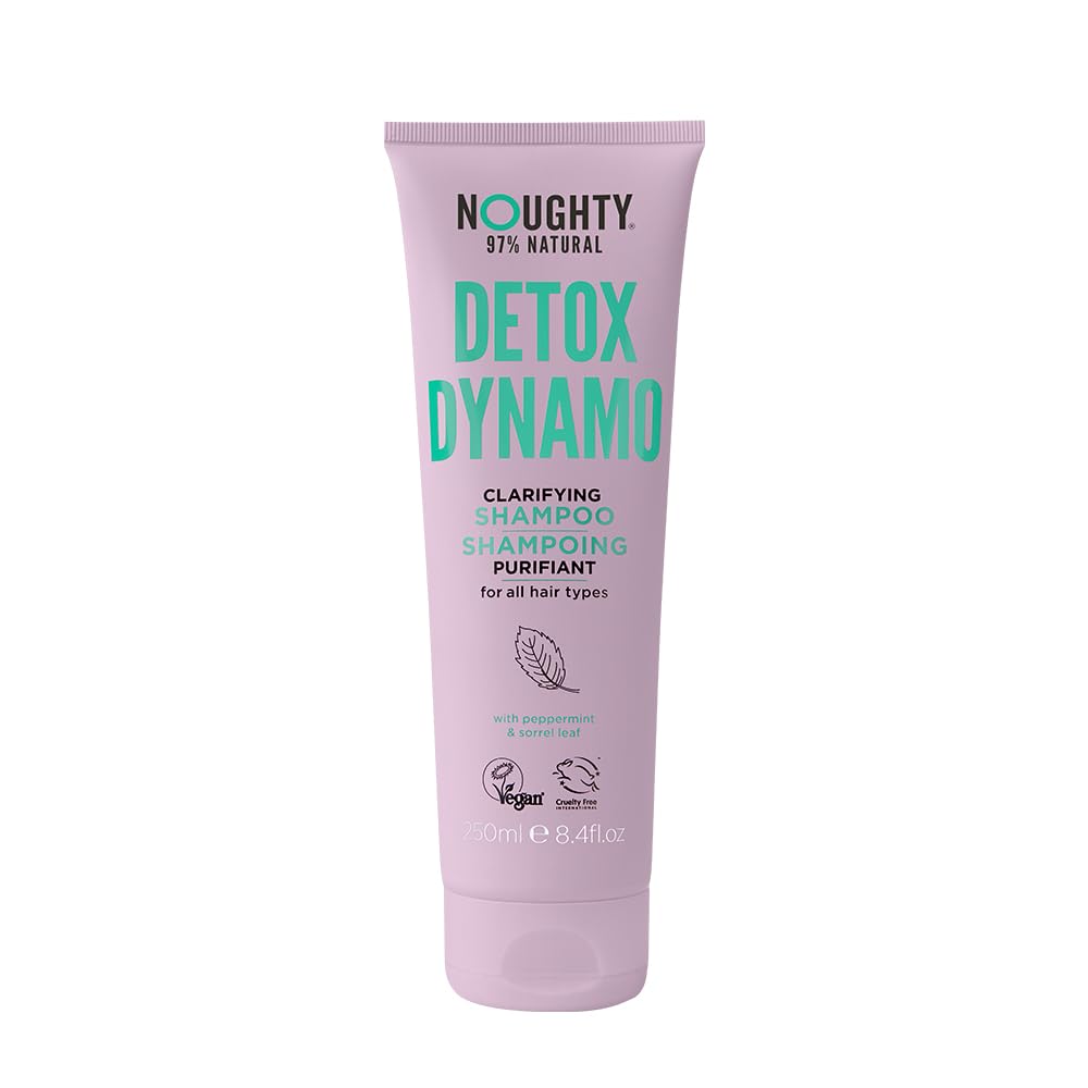 Noughty Detox Dynamo clarifying shampoo bottle pours with a refreshing peppermint scent for residue removal.