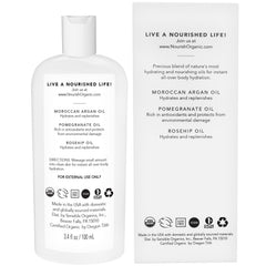 Nourish Organic Beauty Oil bottle with argan, pomegranate, and rosehip blend for radiant skin.