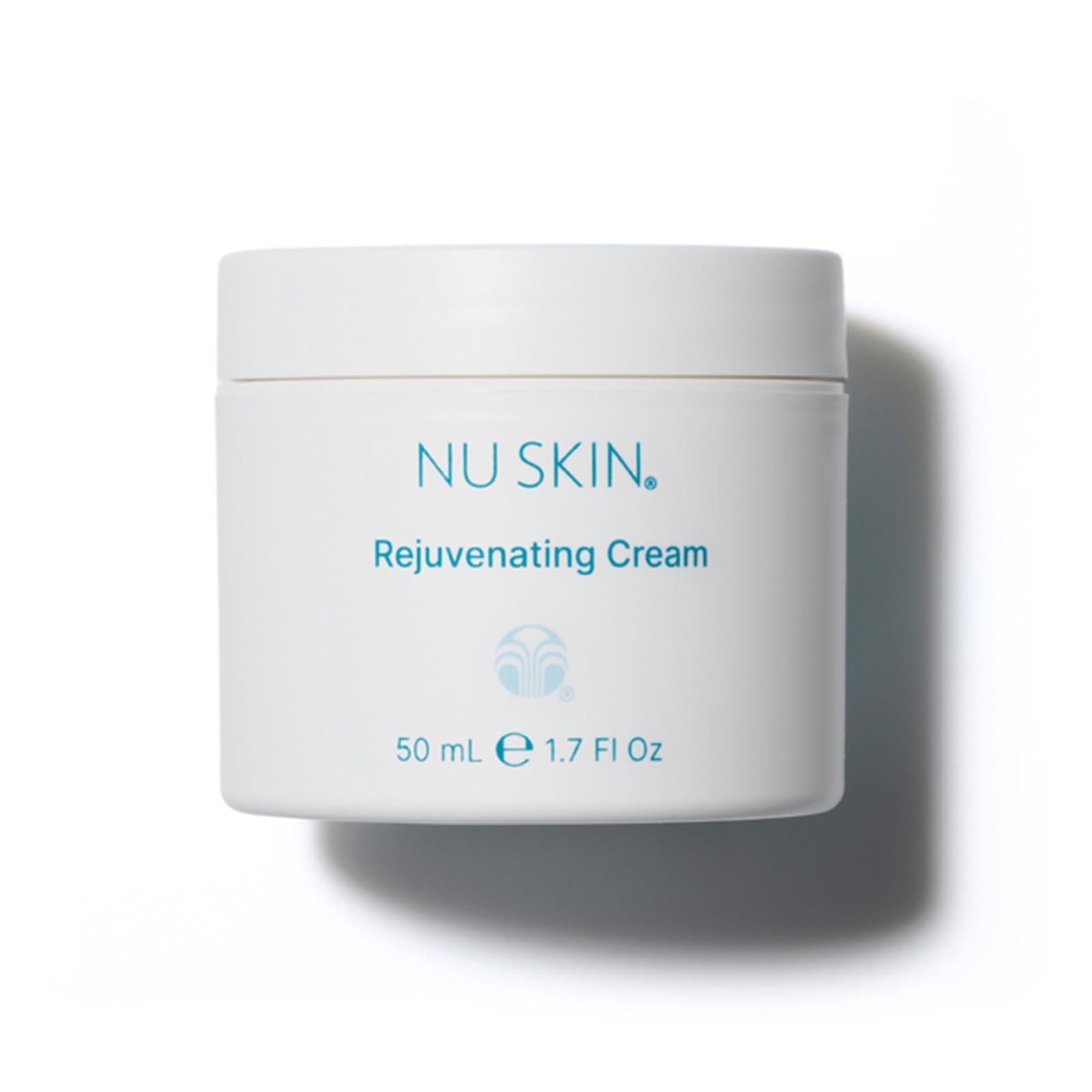Nu Skin Rejuvenating Cream bottle closeup highlighting hydrating formula for dry skin.