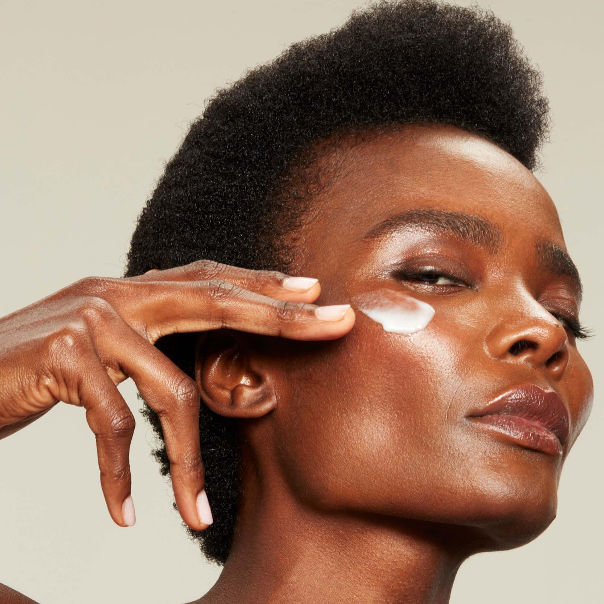 NuFACE Silk Creme Activator on neck area suggesting lift and hydration
