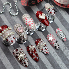 Nxtpz rhinestone detail on leopard nails creates subtle sparkle