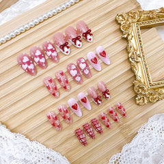 NZRAESTRS medium almond nails with a 3D bow design for elegant everyday wear