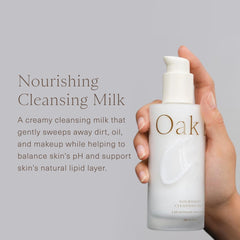 Oak Essentials Nourishing Cleansing Milk being massaged to remove makeup softly.