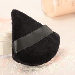 Ocim velour triangle puff close-up showing plush softness and powder pickup.