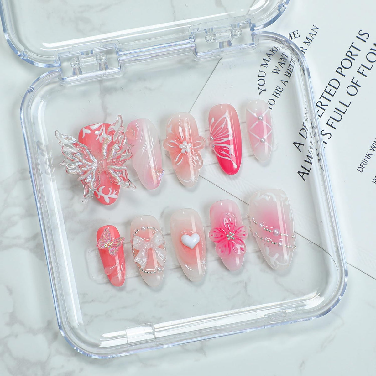OCOUYVD handmade press‑on nails in pink almond with a 3D butterfly bow for elegant evenings