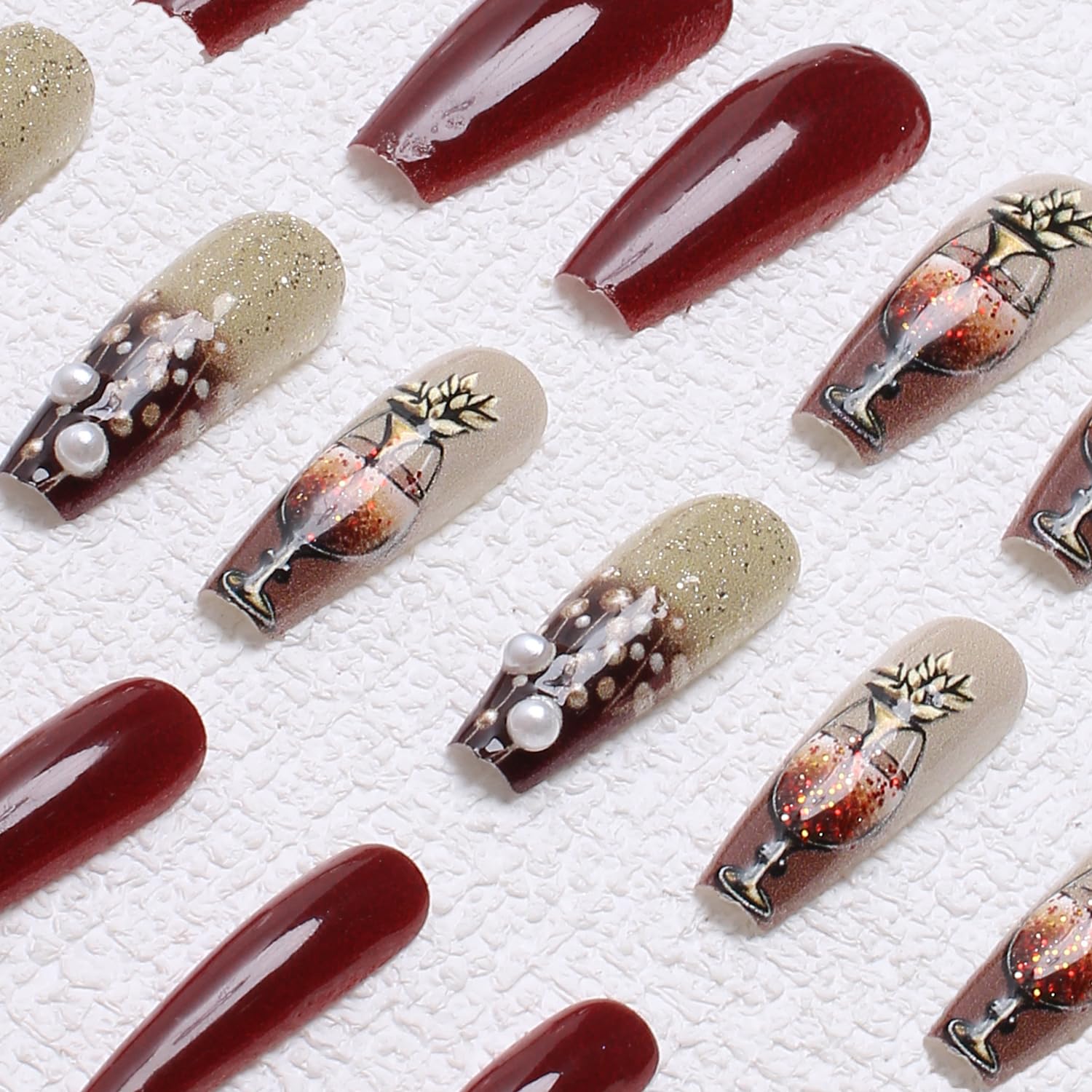 OCOUYVD New Year themed coffin nails with wine glass accents for celebrations.