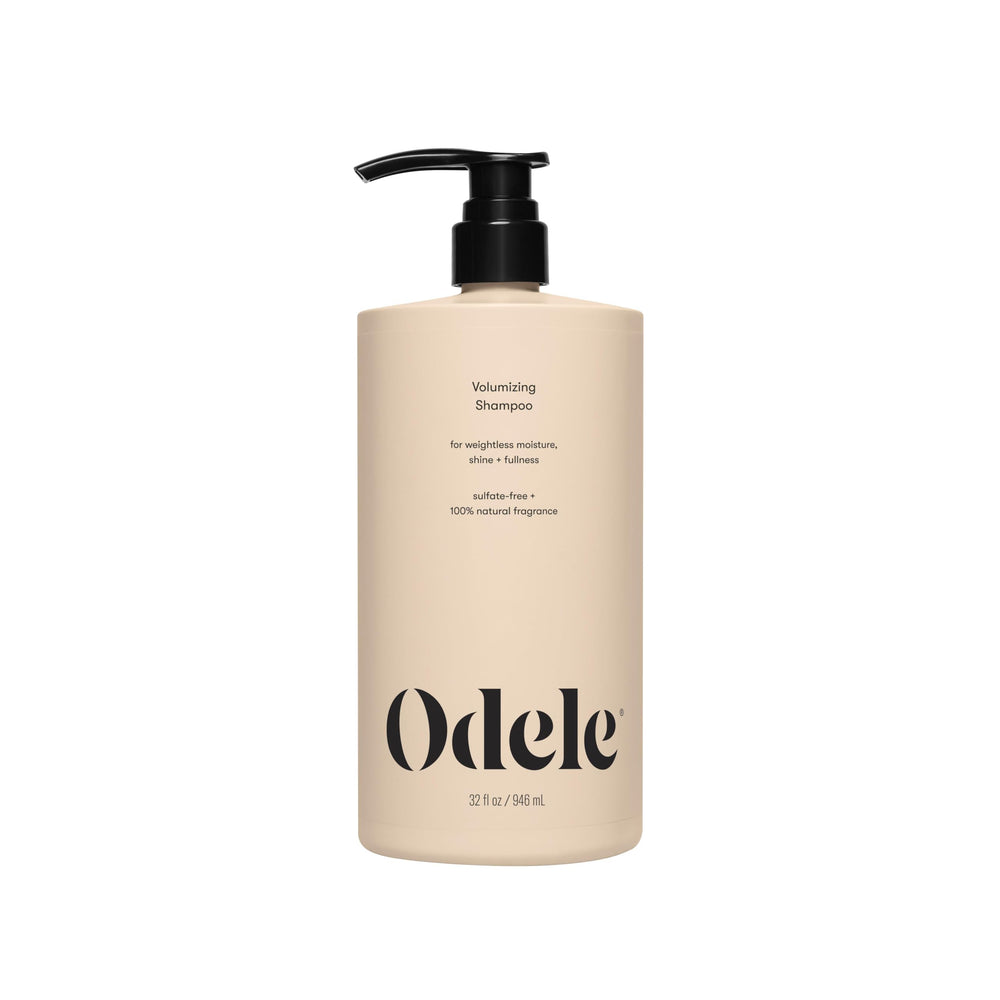Odele Volumizing Shampoo bottle on a vanity, for lightweight cleansing and shine.