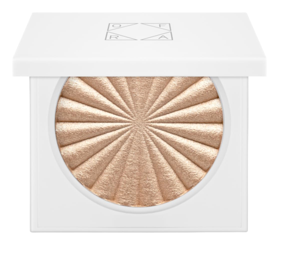 Ofra highlighter Rodeo Drive bottle swatch showing champagne glow