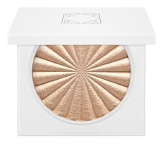 Ofra highlighter Rodeo Drive bottle swatch showing champagne glow