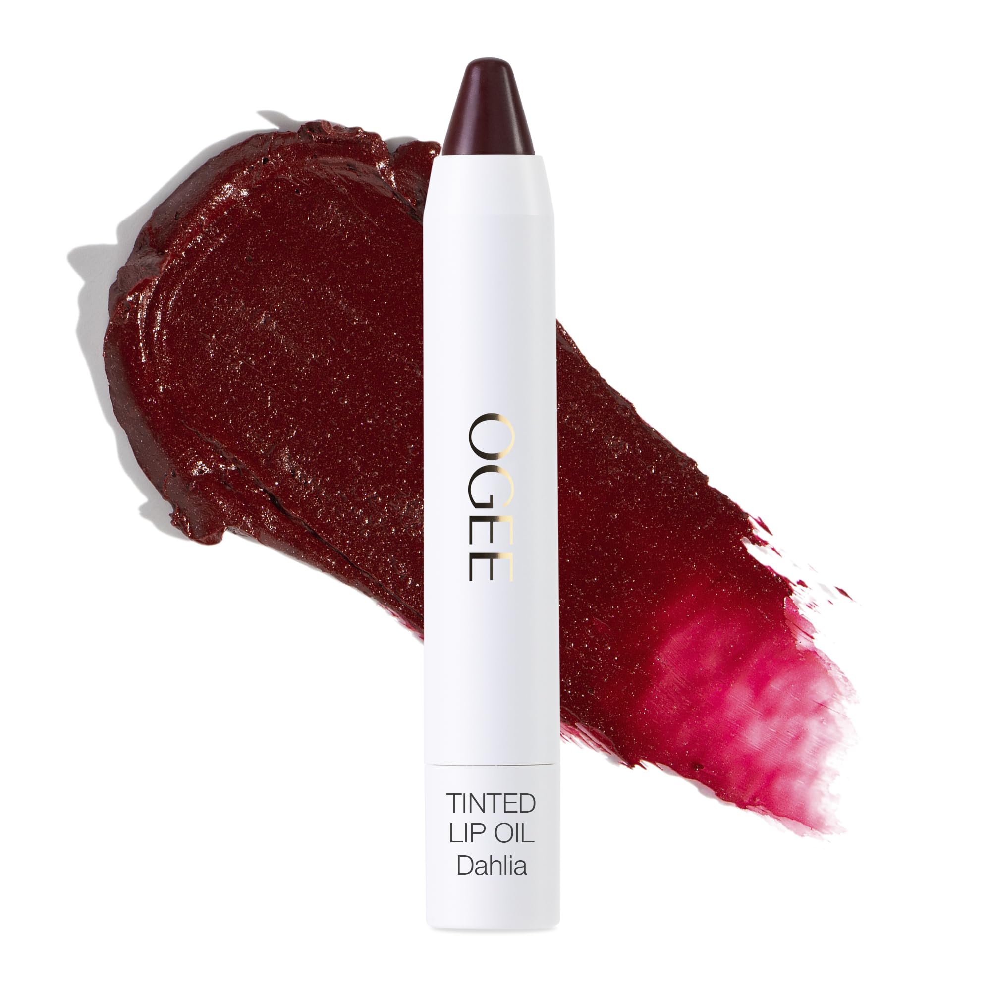 Ogee Dahlia lip oil bottle shows burgundy tint with nourishing oils.