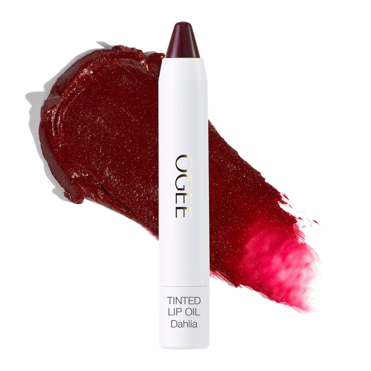 Ogee Dahlia lip oil bottle shows burgundy tint with nourishing oils.
